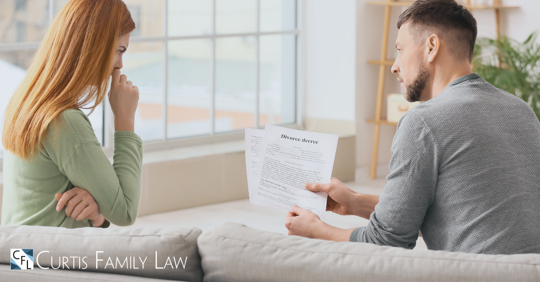 man giving divorce papers to crying woman